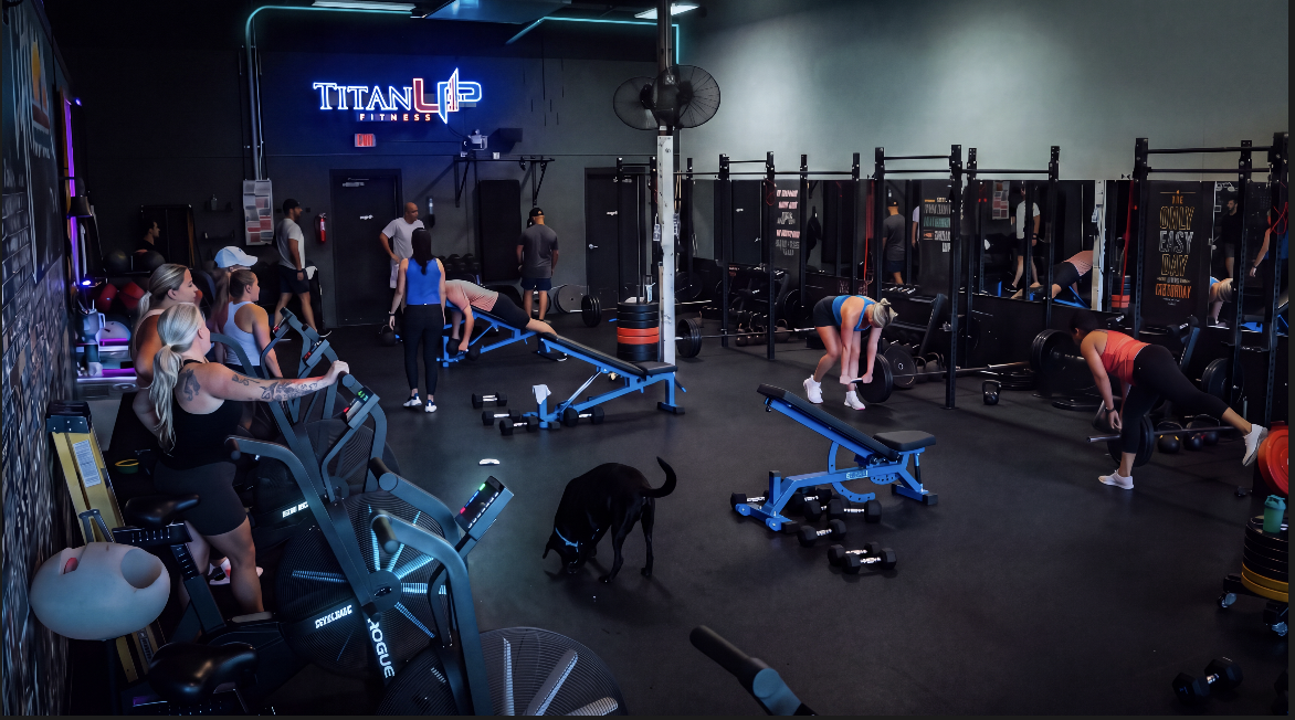 Main training floor at TitanUp Jacksonville Beach under the neon TitanUp sign